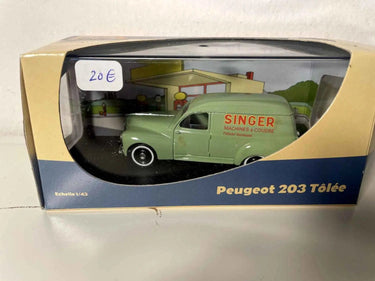Peugeot 203 verte avec la publicité SINGER Bernard Miniatures
