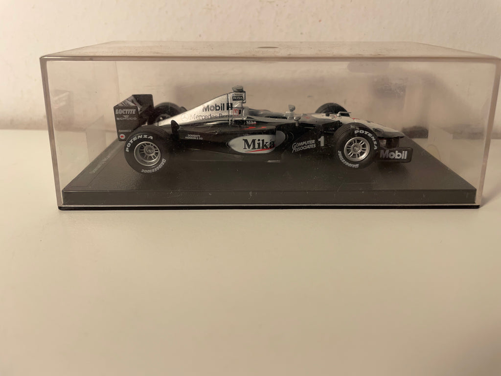 McLaren Mercedes MP4/14 noire, grise et blanche numéro 1 de 1999 - Formule 1
