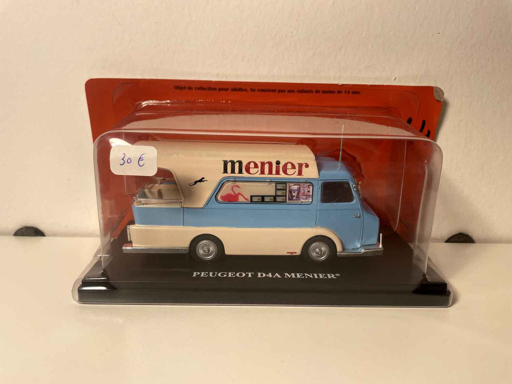 Peugeot D4A azul y blanco roto con publicidad de chocolate MENIER