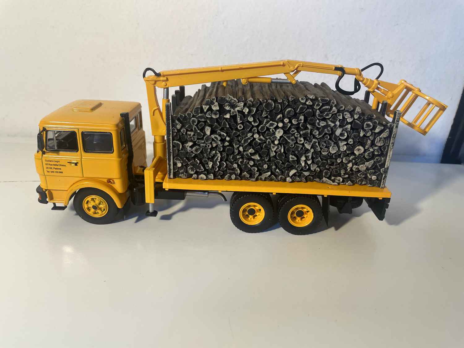 Yellow FIAT 190H truck transporting timber