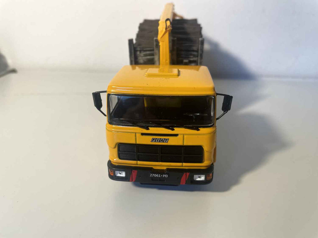 Yellow FIAT 190H truck transporting timber