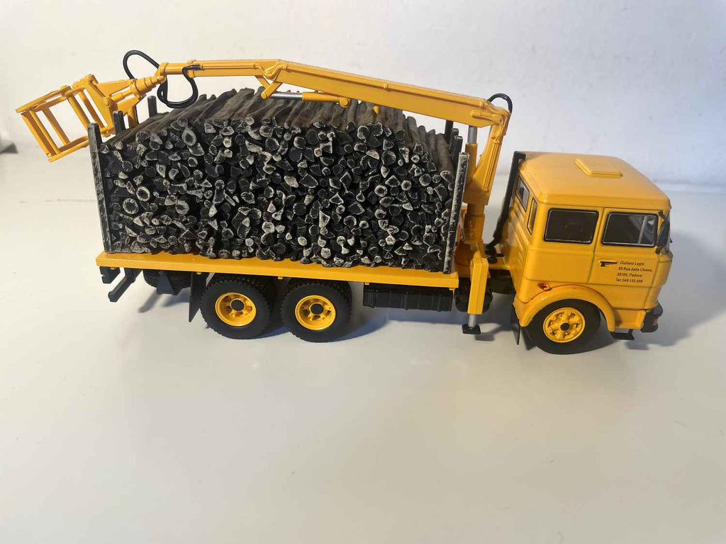 Yellow FIAT 190H truck transporting timber
