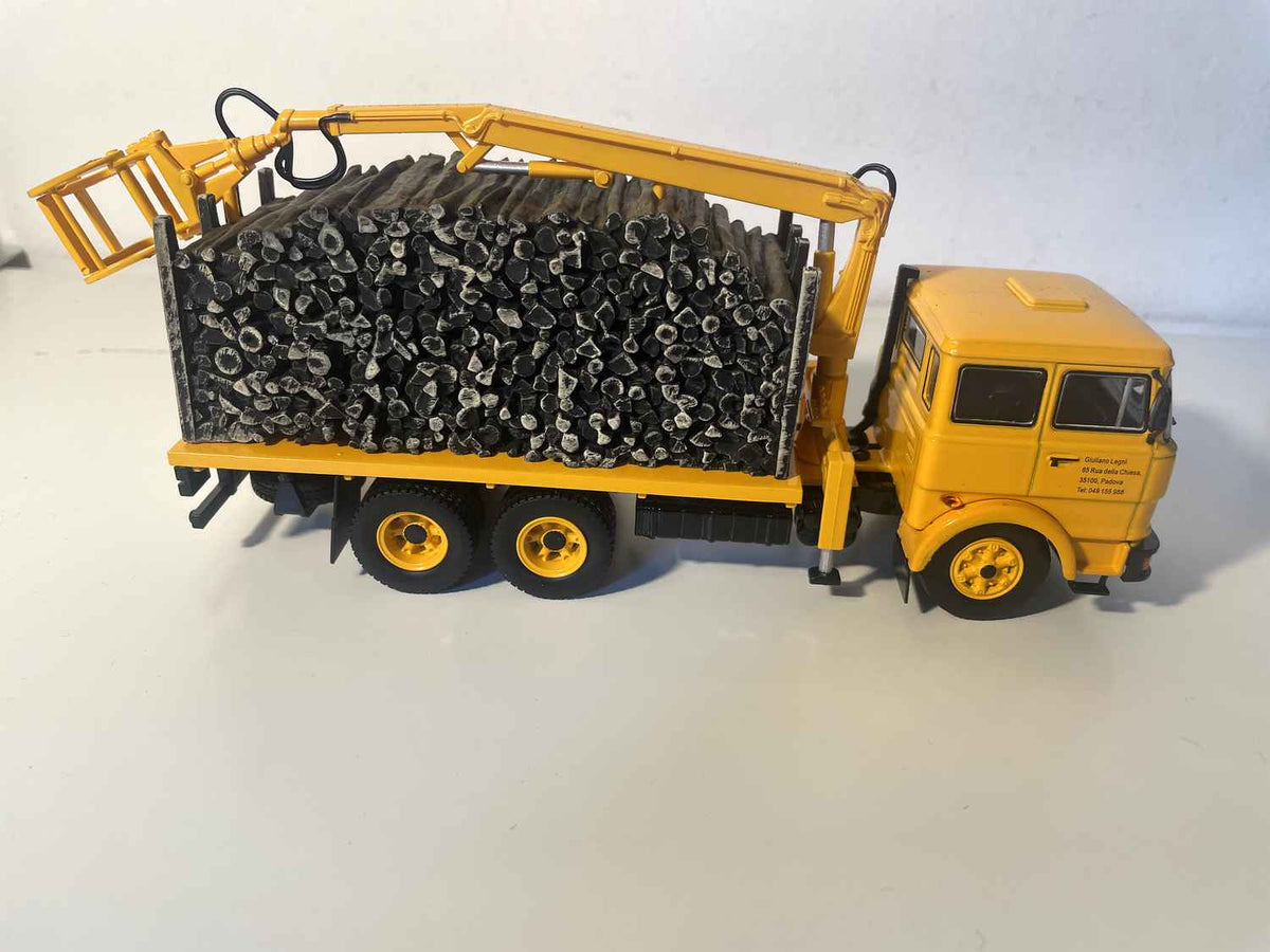 Yellow FIAT 190H truck transporting timber