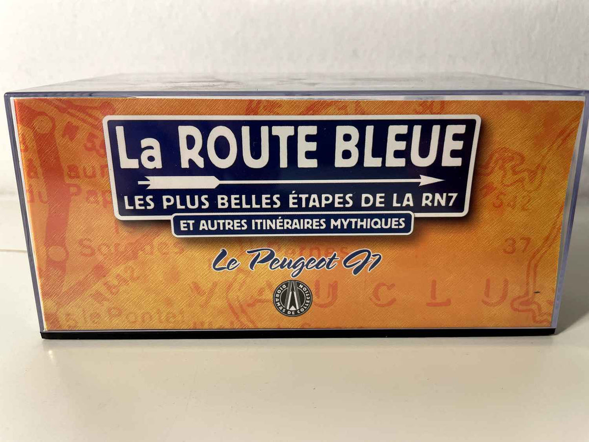 Peugeot J7 wäiss mat blauem Dack - La Nationale - déi blauen Straßen