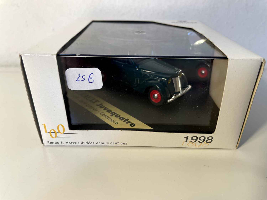 Ciemnozielony Renault Juvaquatre z 1939 roku z reklamą SINGER (kwadratowe pudełko)