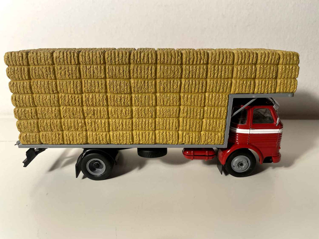 1964 Pegaso Comet truck (red cab truck and gray straw transport platform)