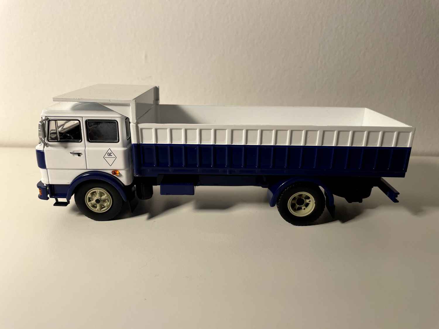 FIAT IVECO 619 truck with white cab and blue and white dump body