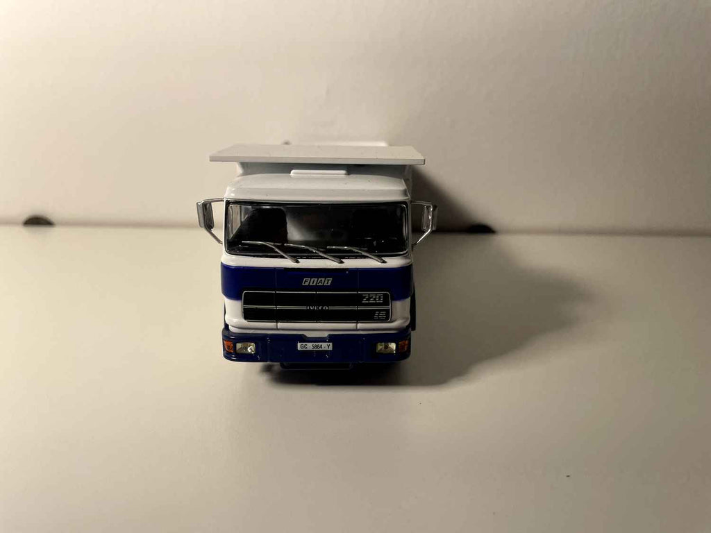 FIAT IVECO 619 truck with white cab and blue and white dump body