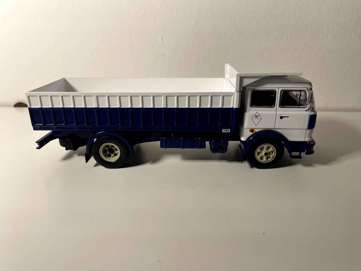 FIAT IVECO 619 truck with white cab and blue and white dump body