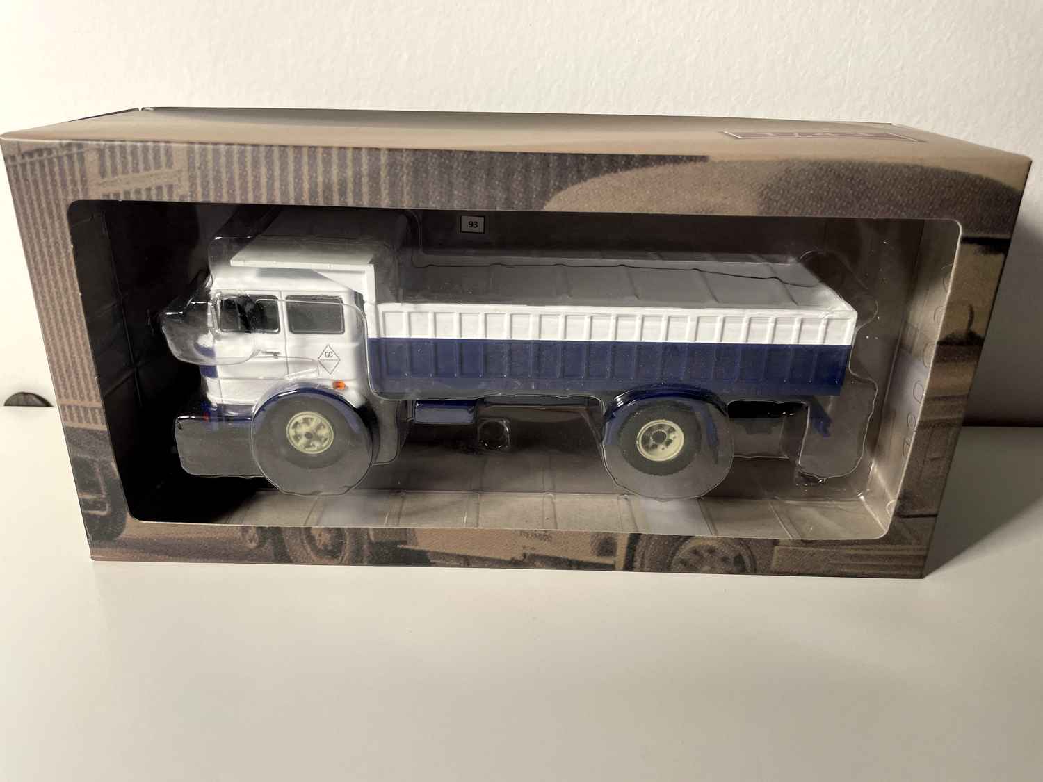 FIAT IVECO 619 truck with white cab and blue and white dump body