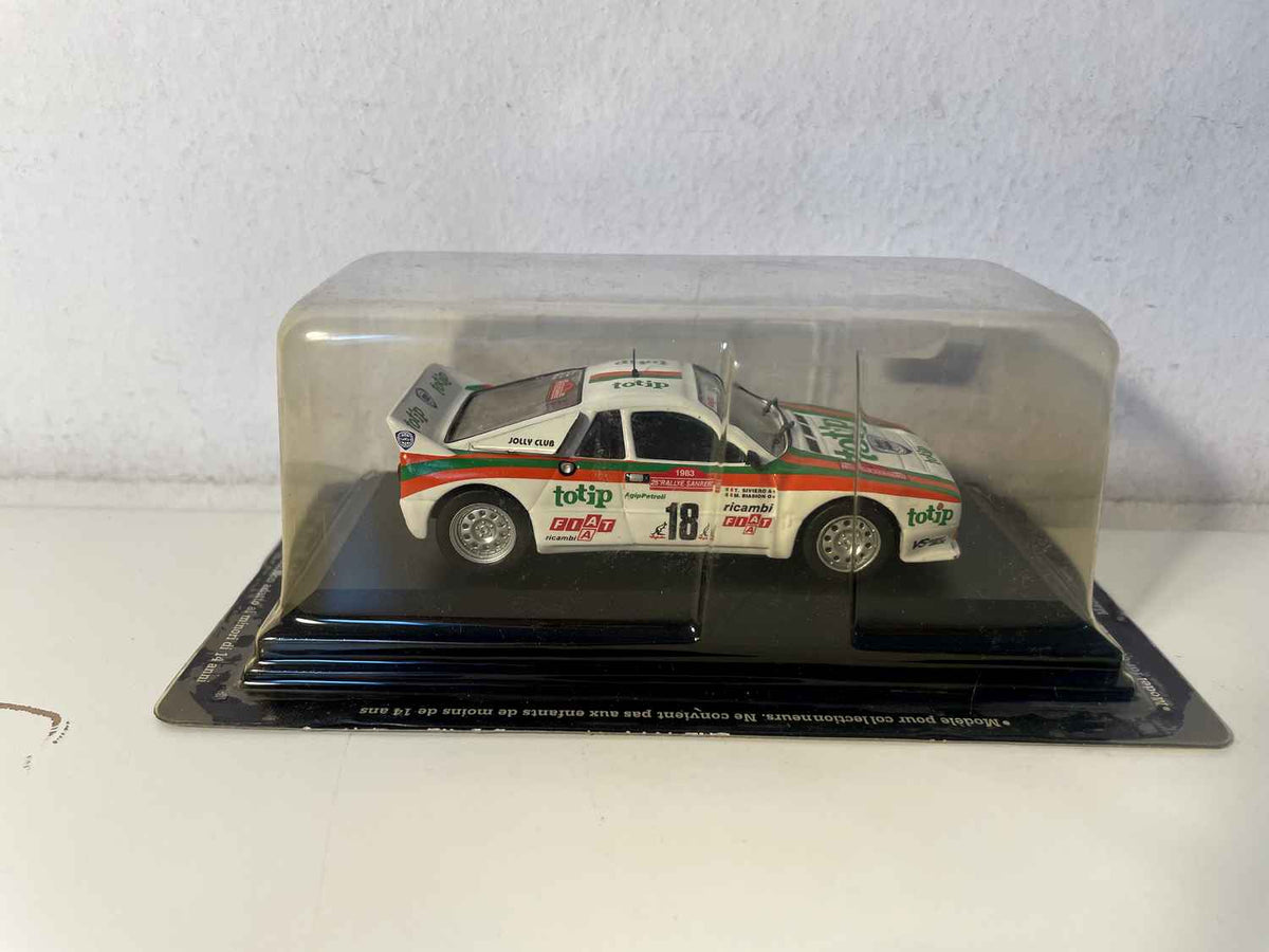 Weißer, orangefarbener und grüner Lancia 037 Rally Nummer 18 – Rallye San Remo 1983