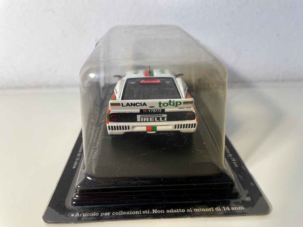 Weißer, orangefarbener und grüner Lancia 037 Rally Nummer 18 – Rallye San Remo 1983