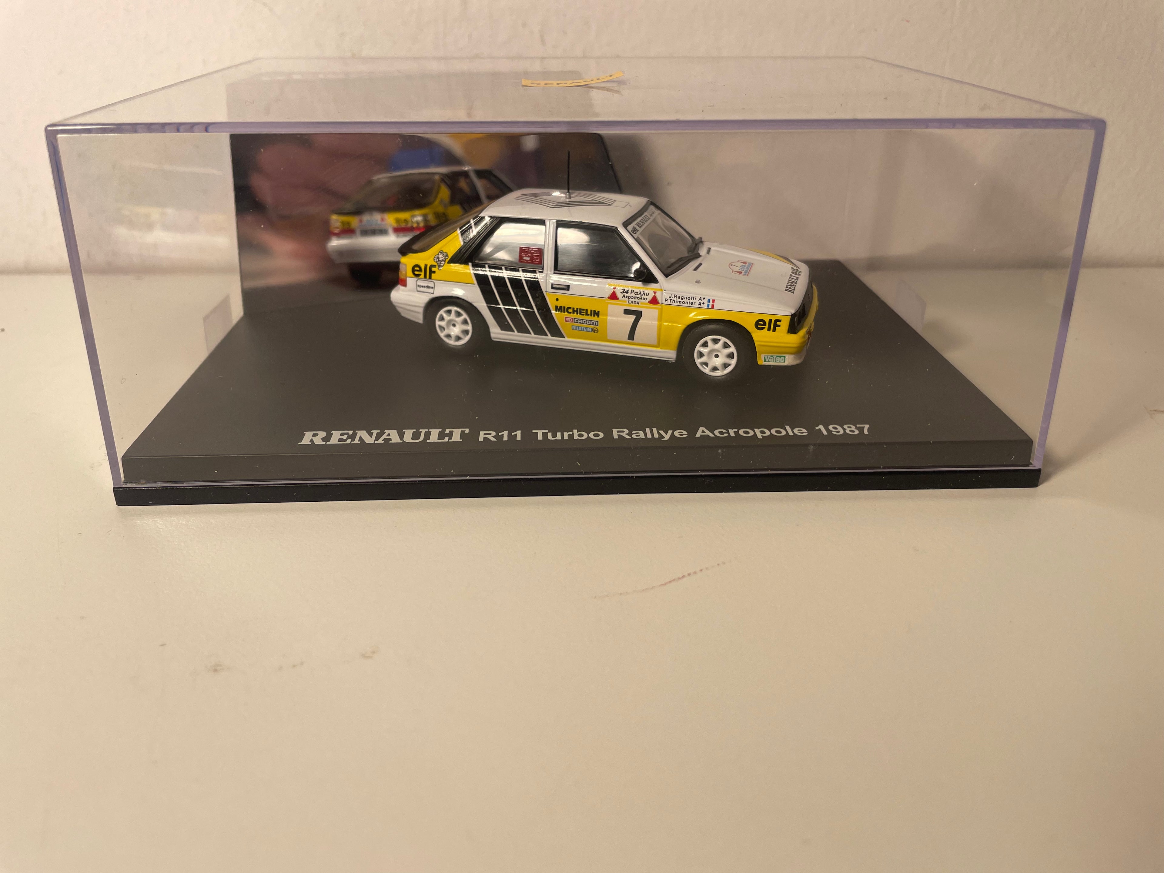 Renault 11 Turbo blanche, jaune et noire numéro 7 - rallye de l'Acropole de 1987 - IXO (coffret boite rectangle)