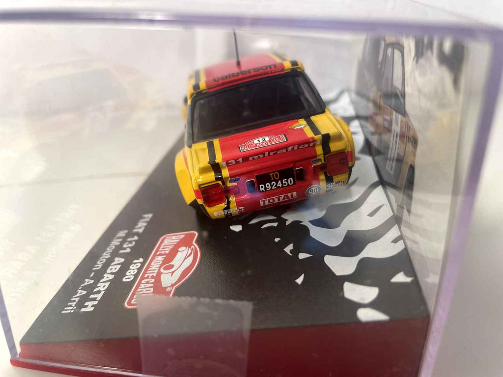Fiat 131 Abarth żółty, czerwony i czarny numer 12 - Rajd Monte Carlo 1980