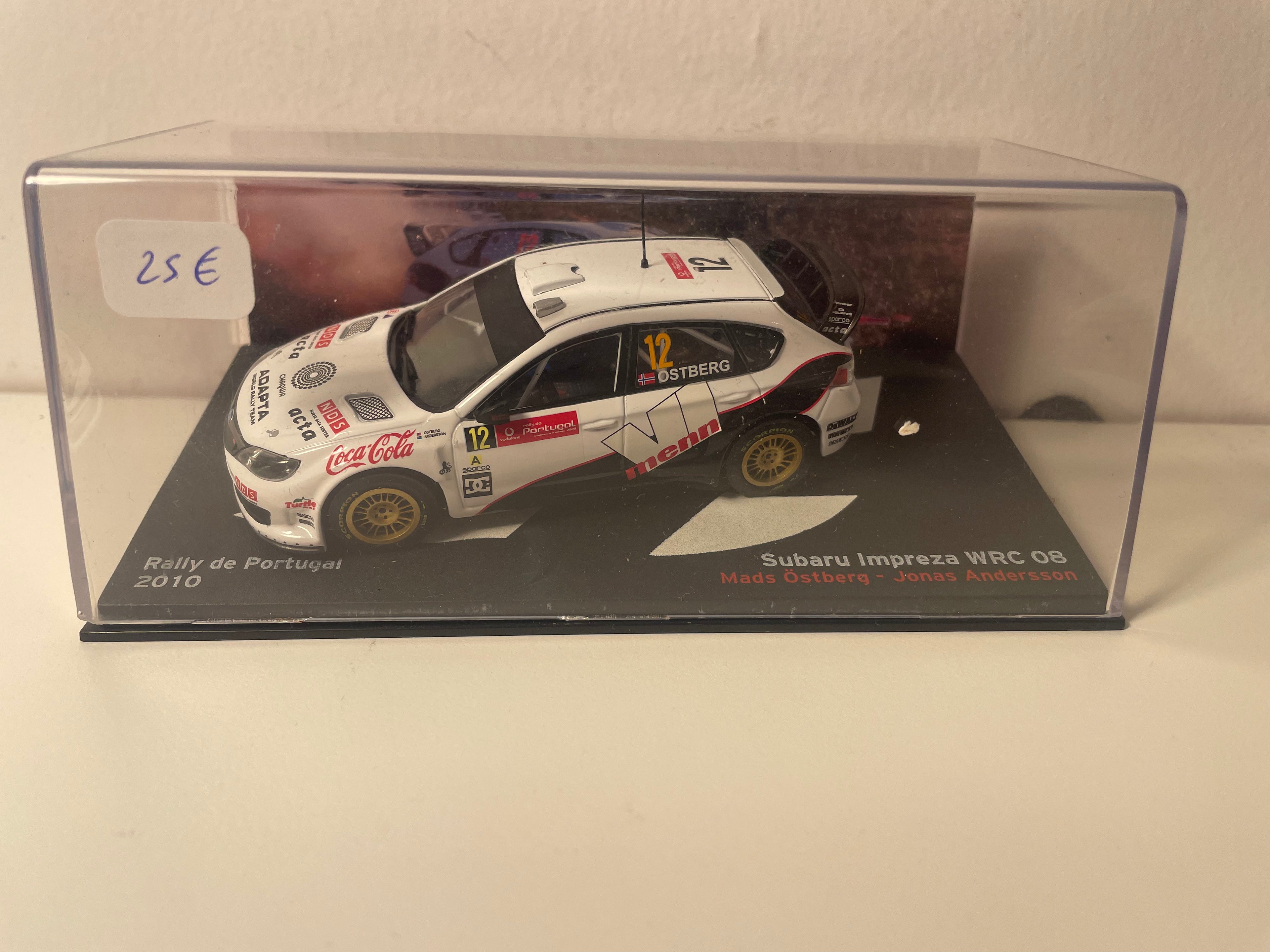 Subaru Impreza WRC 08 biała i czarna numer 12 - rajd Portugalii 2010