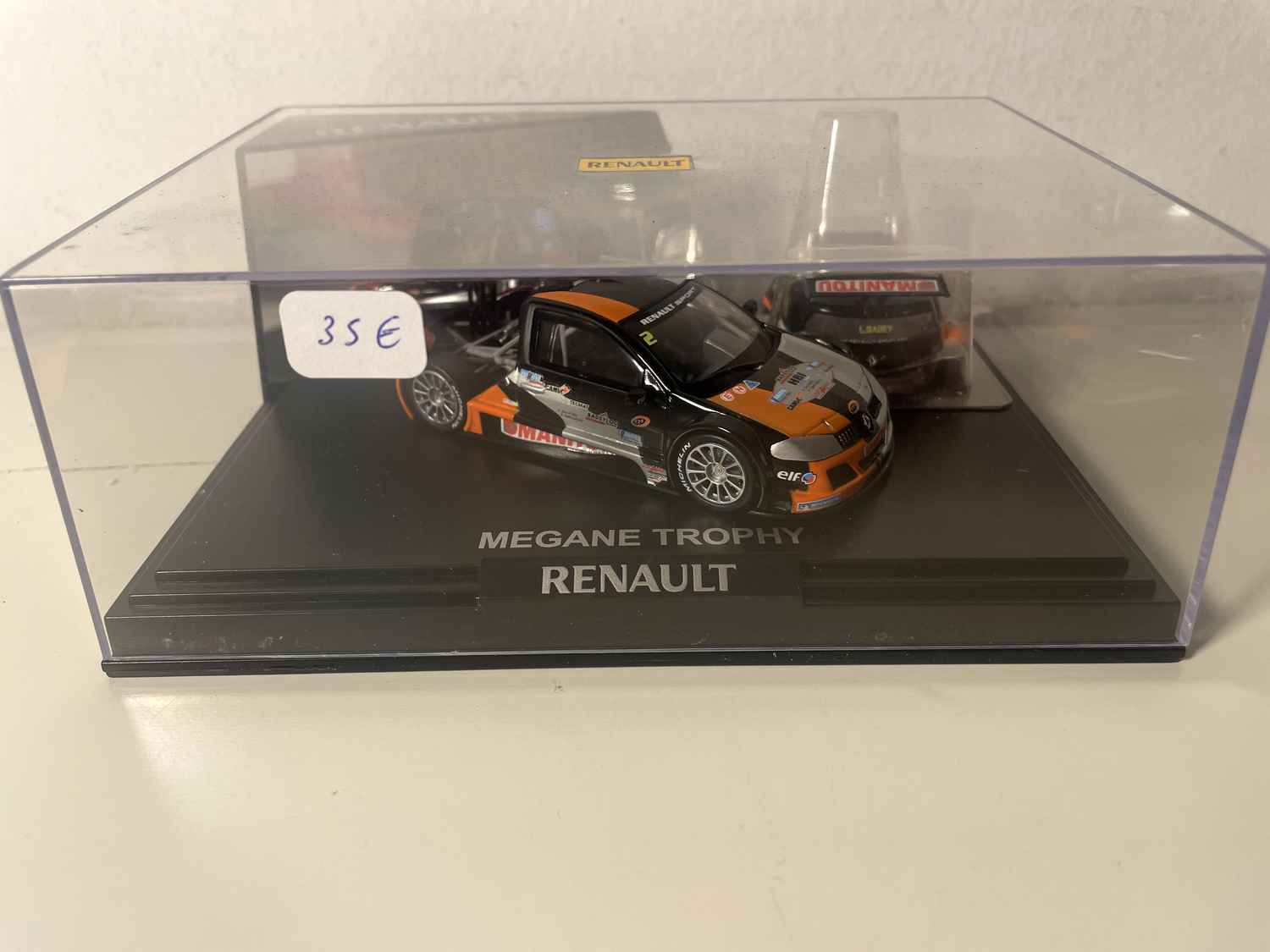 Mégane Trophy czarna, pomarańczowa i szara (coffret boite rectangle) - Boite N°1 - NOREV