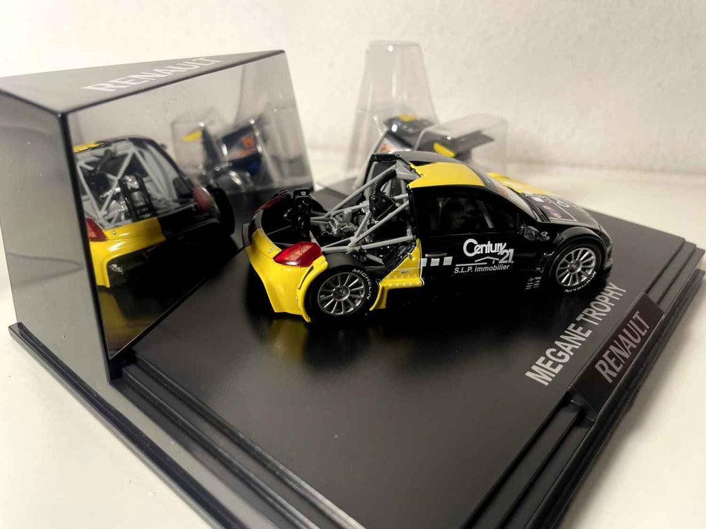 Mégane Trophy zwart en geel (rechthoekige doos) - Doos Nr. 4 - NOREV