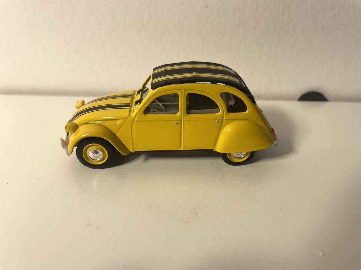 Citroën 2 CV 6 jaune avec rayures noires - Norev (sous blister) (ATTENTION: les phares avants sont de travers)