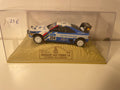 Peugeot 405 Turbo 16 blanche et bleue numéro 204 - Paris-Dakar 1989 (11ème édition)