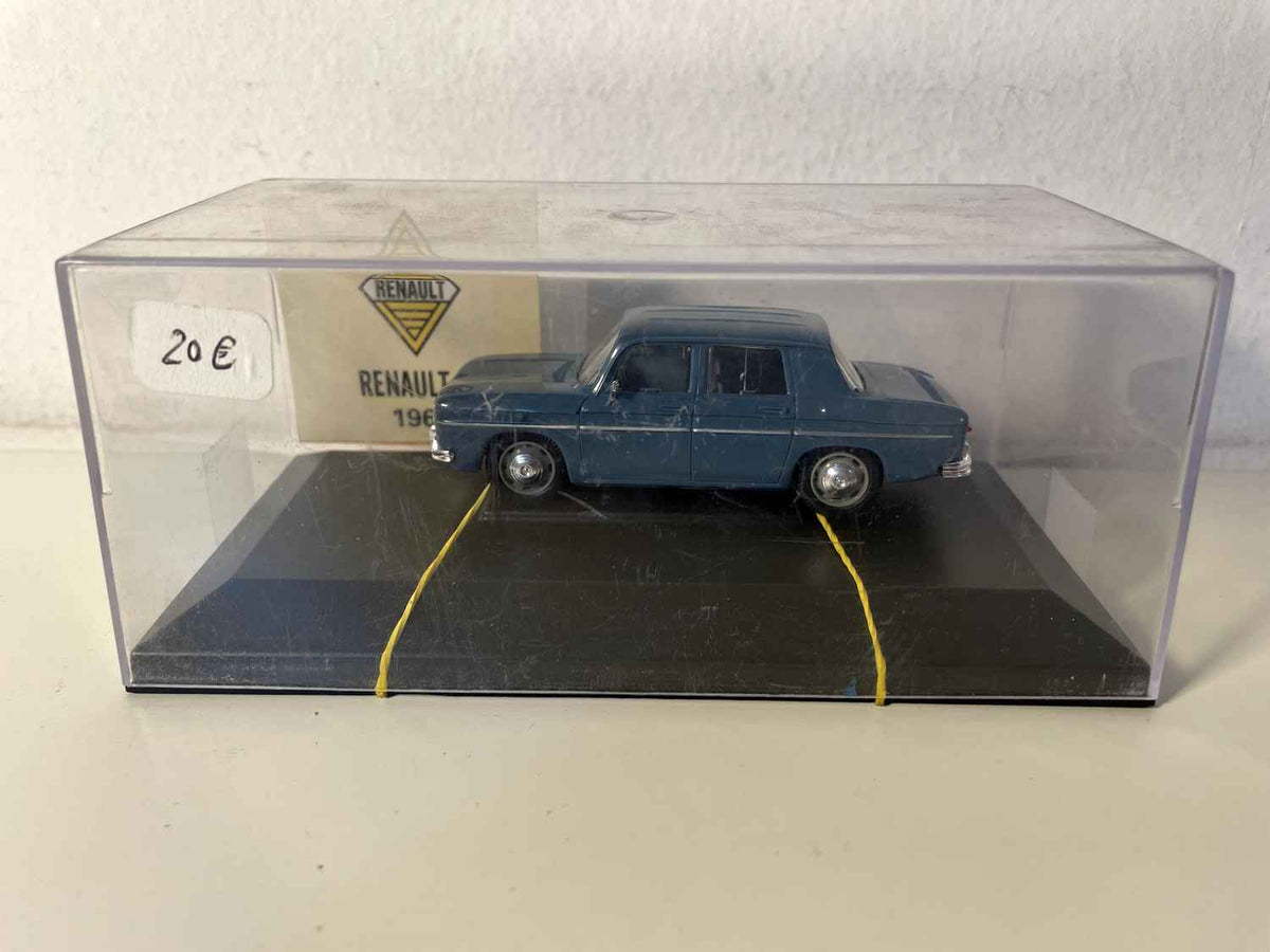 Donkelbloe Renault 8 vun 1968 (Auto mat Gummibander festgehalen)