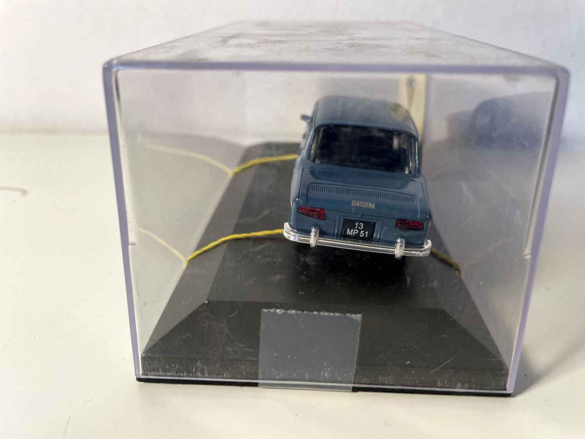 Donkelbloe Renault 8 vun 1968 (Auto mat Gummibander festgehalen)