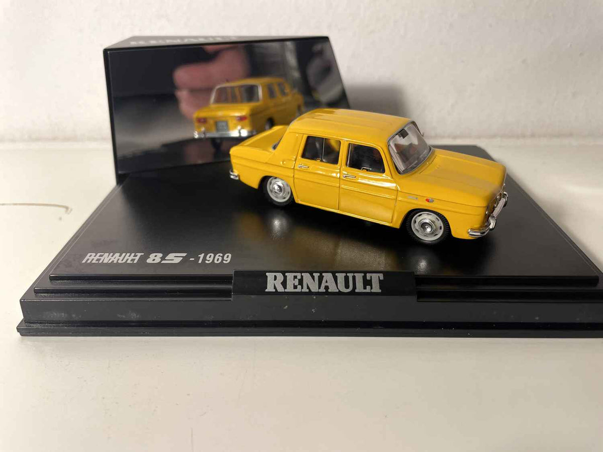 Renault 8S giel vum Joer 1969 (box mat rechteckiger Këscht) - NOREV