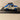 Renault 4 CV Berline Commerziell blo a wäiss griis? Typ R 2070 aus 1949 mat Reklamm fir de Garage Laurent zu Paräis 13. (blister)