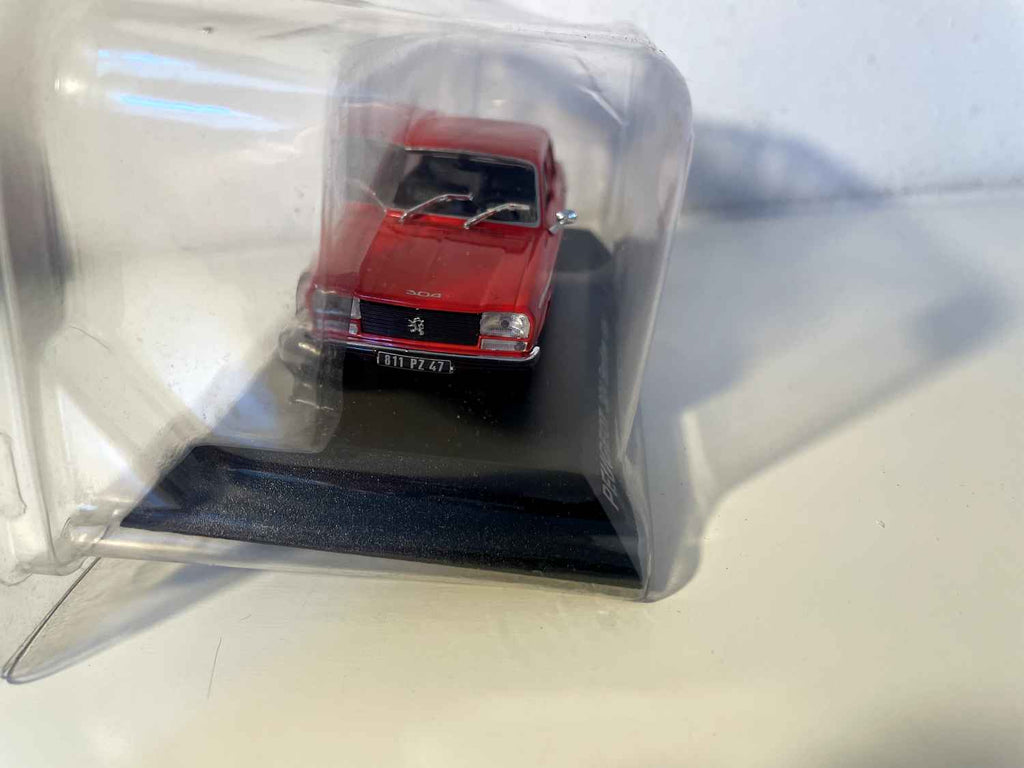 1979 red Peugeot 304 sedan