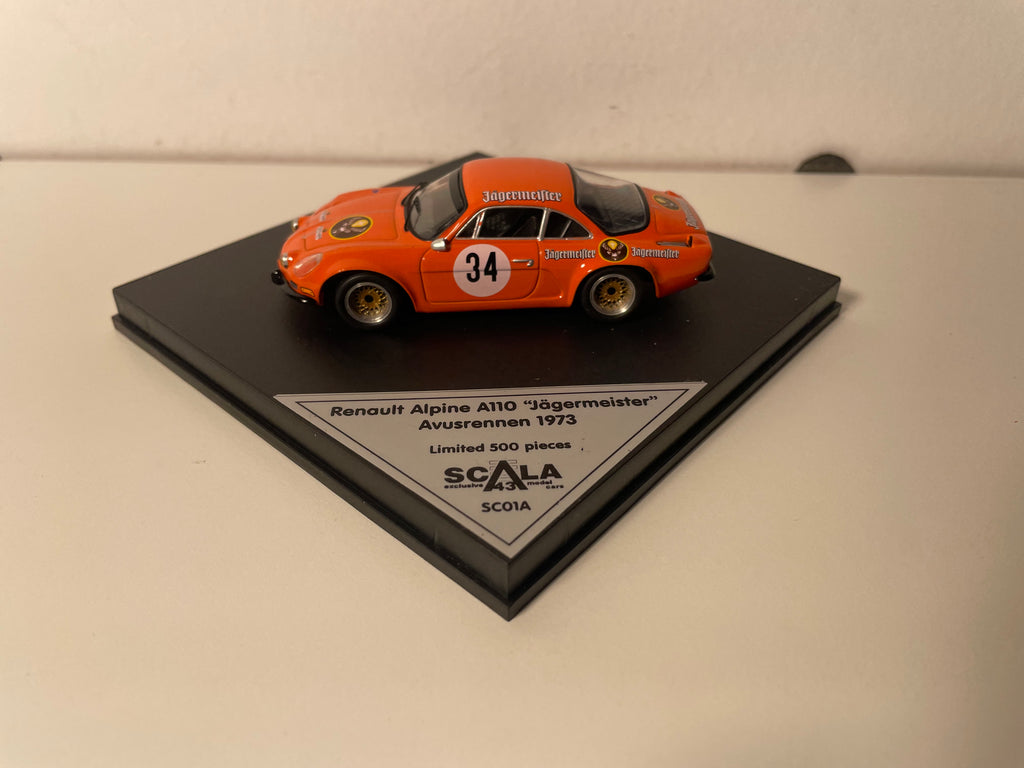Renault Alpine A110 oranje nummer 34 "Jägermeister" Avusrennen 1973 - TROFEU SCALA 43 modelauto (beperkte editie)