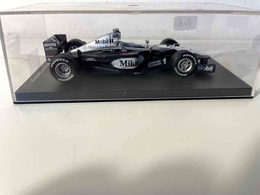 McLaren Mercedes MP4/14 zwart, grijs en wit nummer 1 uit 1999 (Formule 1)