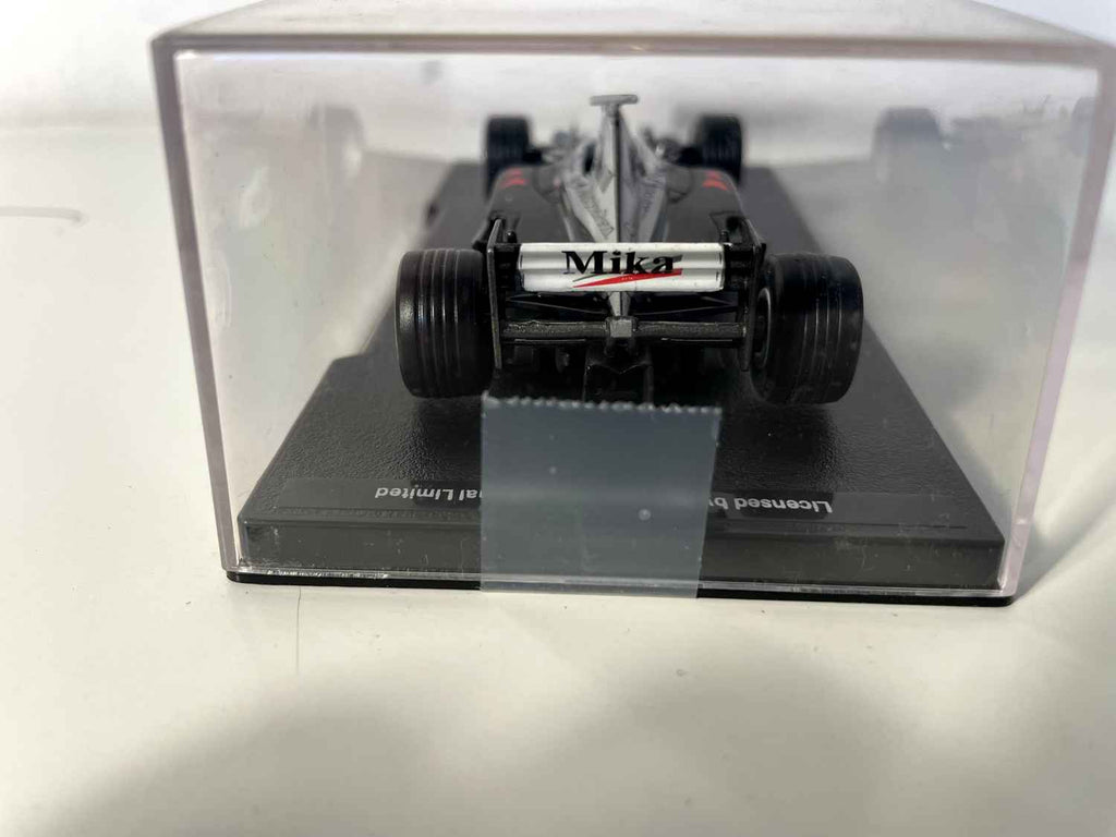McLaren Mercedes MP4/14 zwart, grijs en wit nummer 1 uit 1999 (Formule 1)