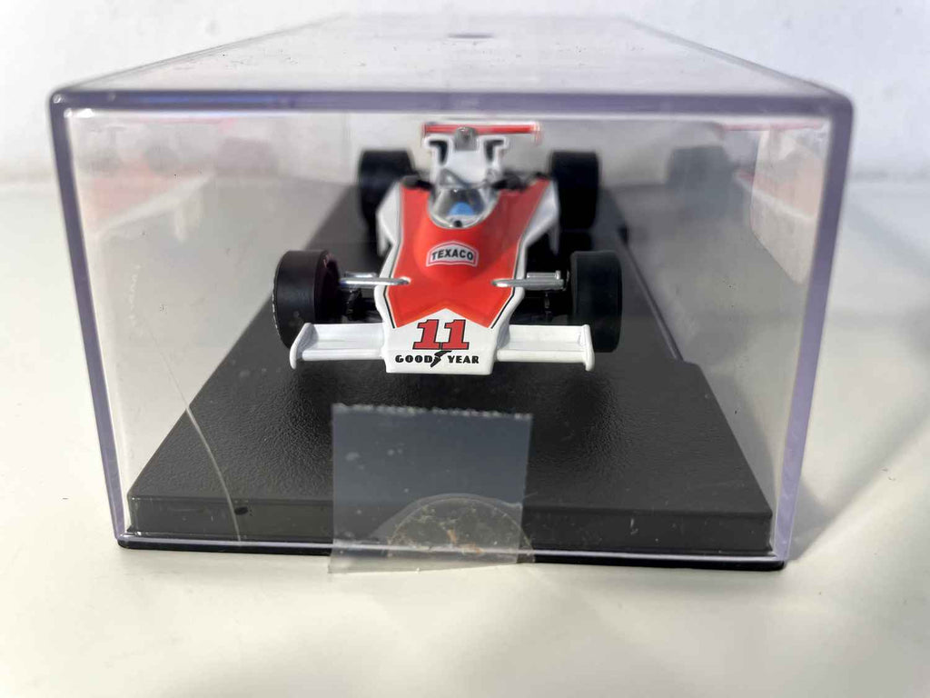 Orange and white McLaren Ford M23 number 11 from 1976 (Formula 1)