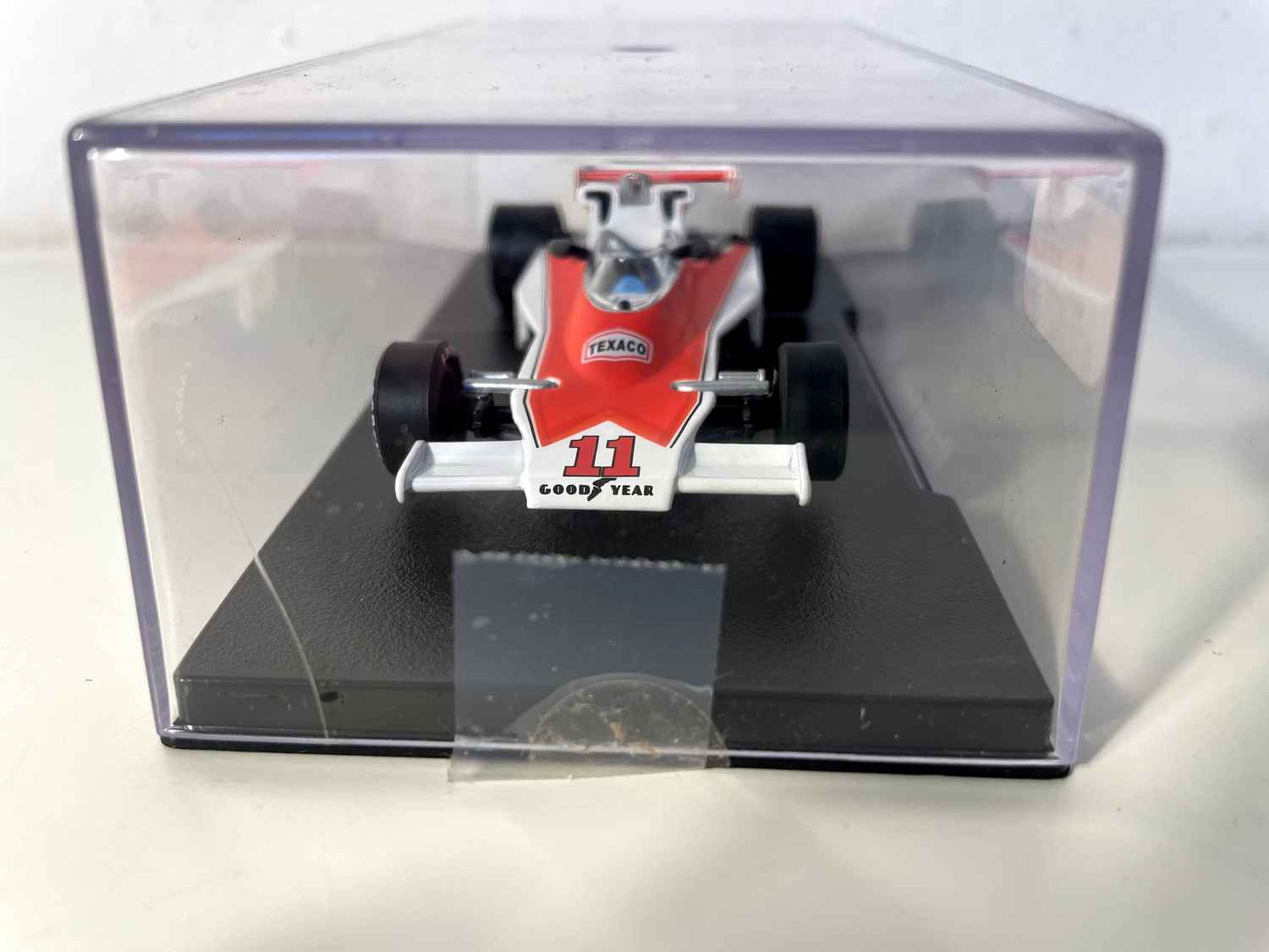 Orange and white McLaren Ford M23 number 11 from 1976 (Formula 1)