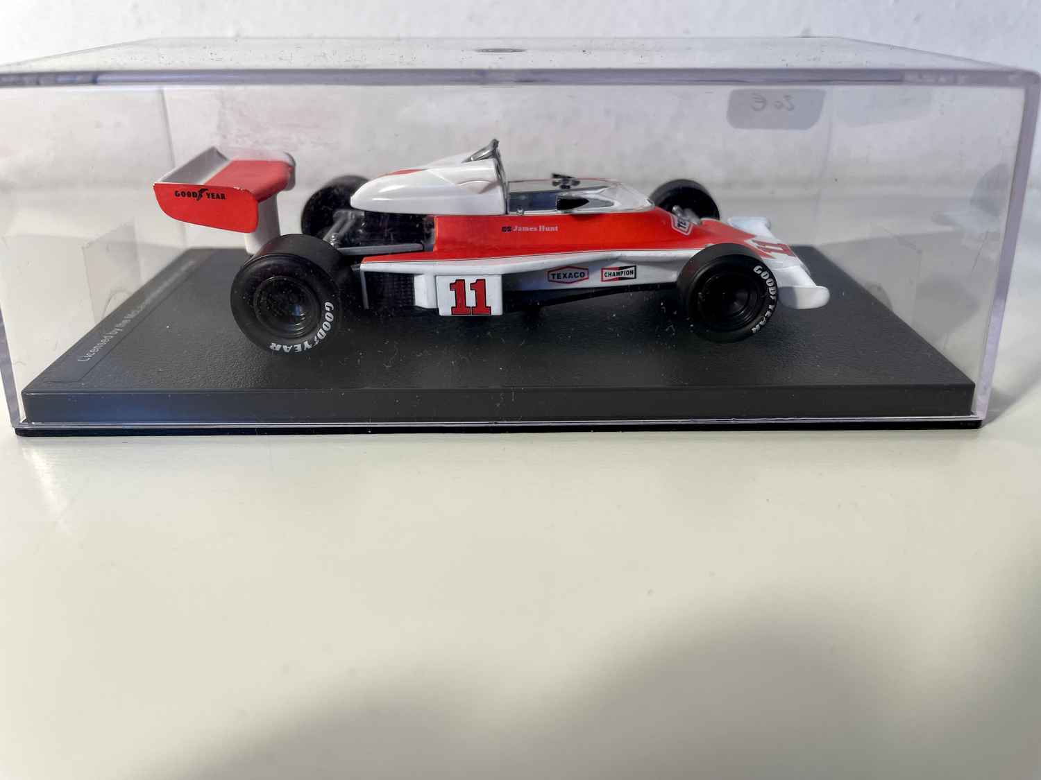 Orange and white McLaren Ford M23 number 11 from 1976 (Formula 1)