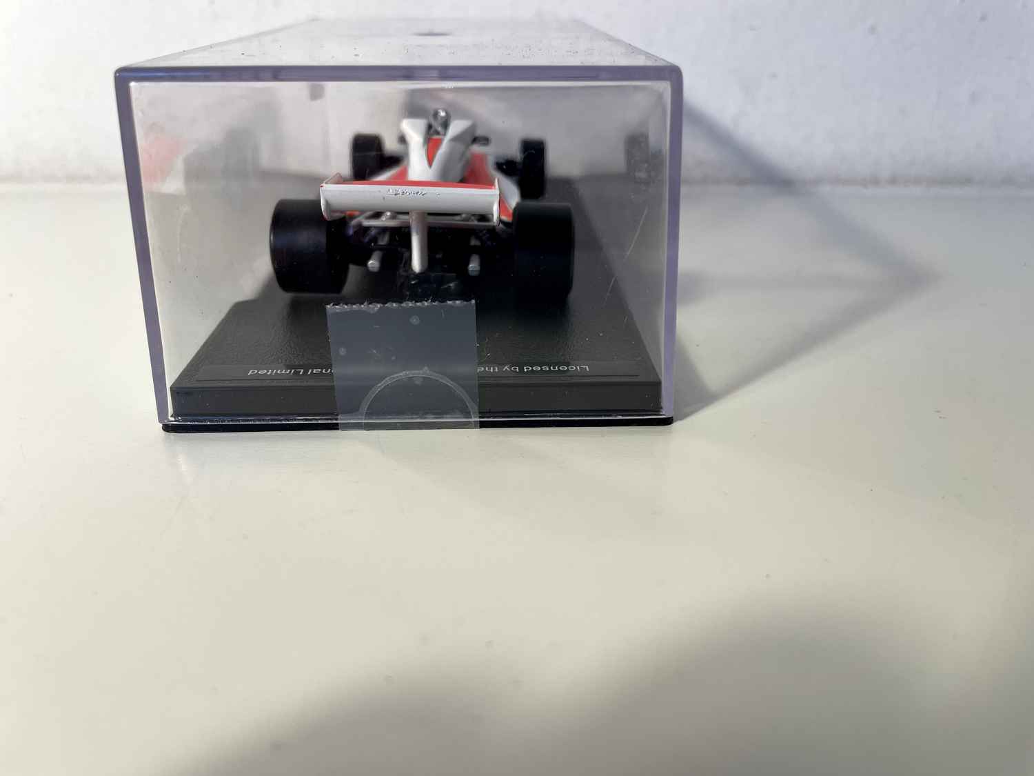Orange and white McLaren Ford M23 number 11 from 1976 (Formula 1)