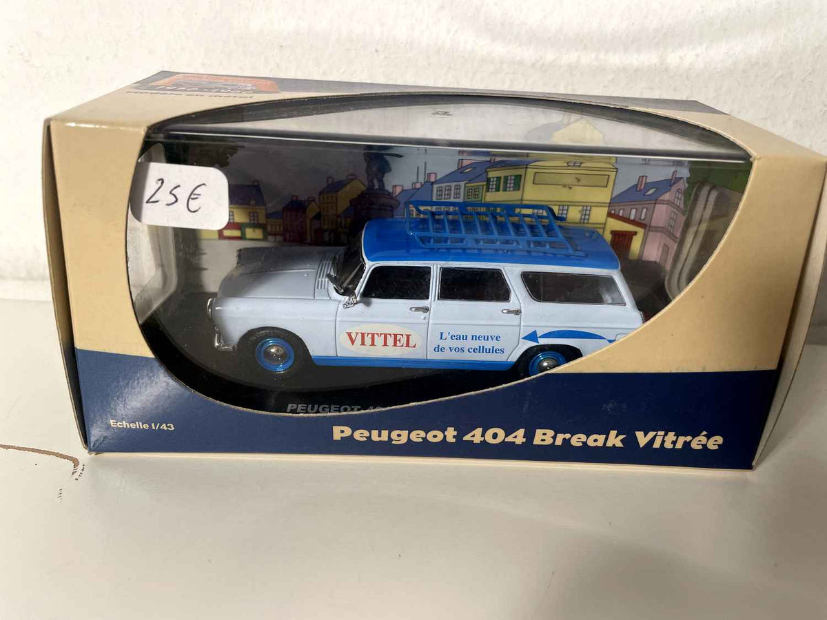 Peugeot 404 blue estate car with VITTEL advertising (for Mr. Marquer)