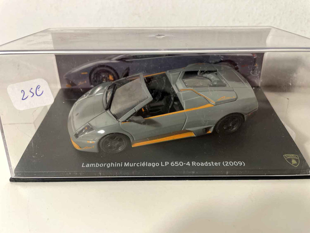 Lamborghini Murciélago LP 650-4 Roadster gris con franjas naranjas de 2009
