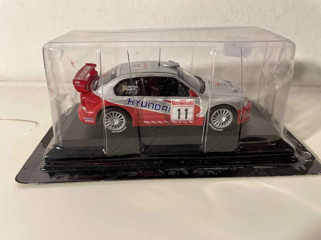 Hyundai Accent WRC grise et rouge numéro 11 - Rallye de Monté-Carlo de 2003 (blister)