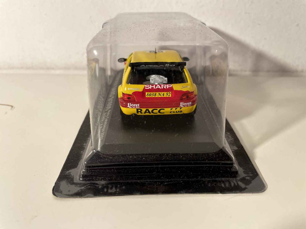 Citroën Saxo S1600 yellow and red number 65 - 2002 Catalunya Rally