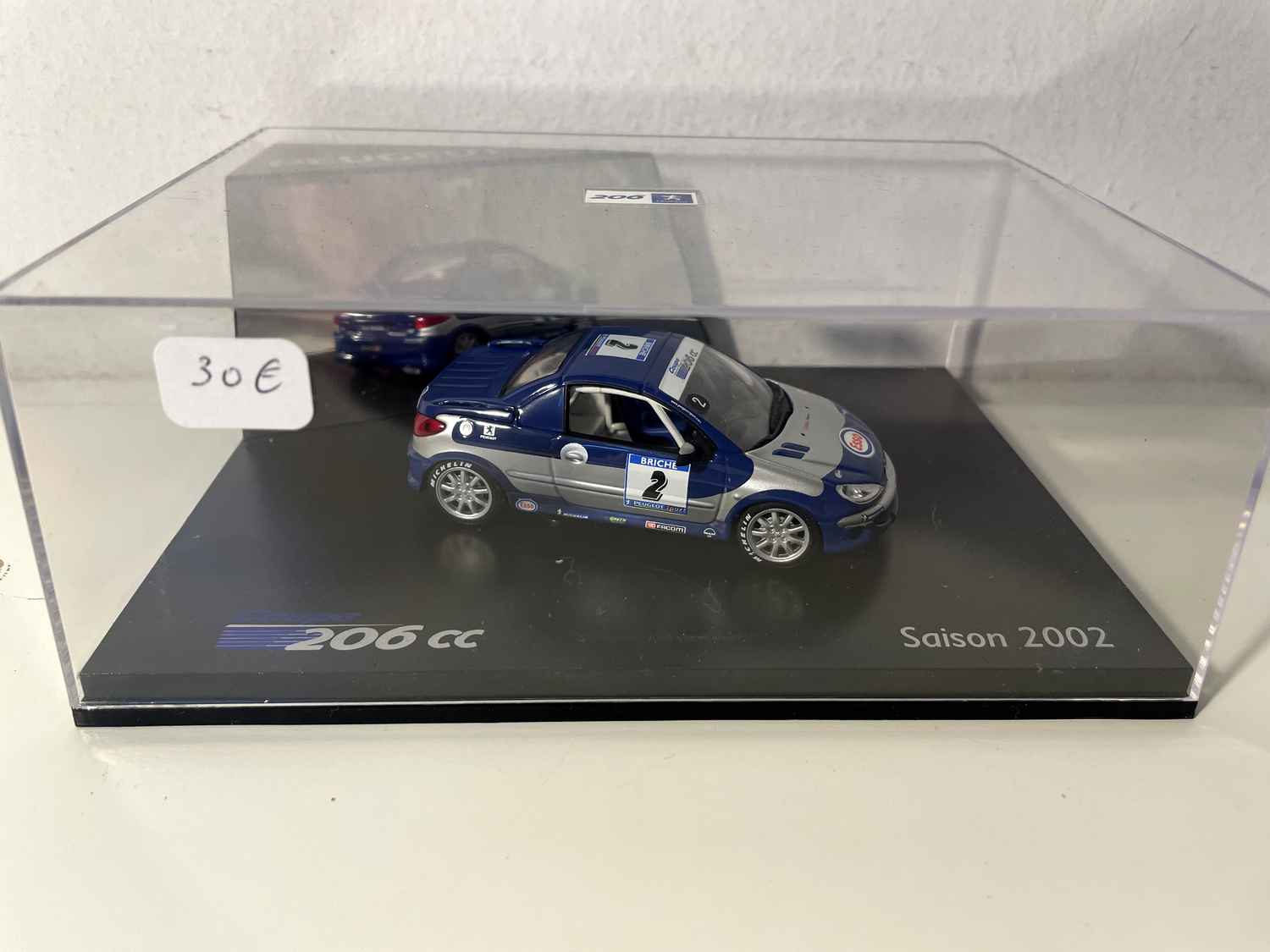 Peugeot 206cc de course bleue et grise avec le numéro 2 saison 2002 (coffret boite rectangle) Norev Bernard Miniatures