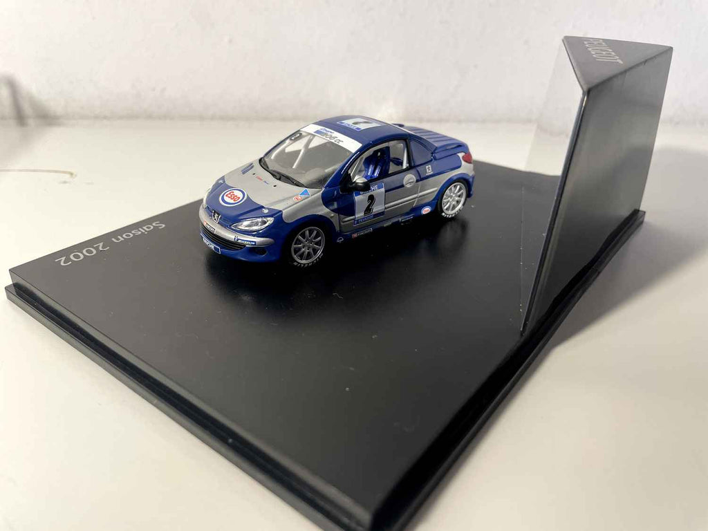 Peugeot 206cc de course bleue et grise avec le numéro 2 saison 2002 (coffret boite rectangle) Norev Bernard Miniatures