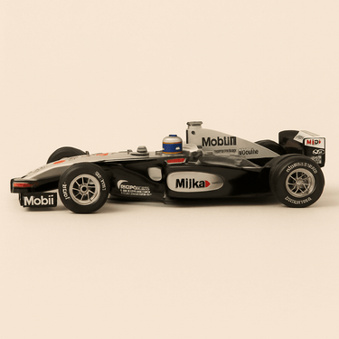 Photo professionnelle de McLaren Mercedes MP4/14 noire, grise et blanche numéro 1 de 1999 (Formule 1) - Image clean haute qualité