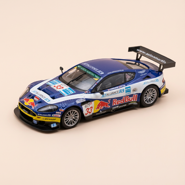 Voiture miniature - Aston Martin DBR9 bleue et blanche numéro 33 - 500 kms de Dijon de 2006