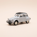 Voiture miniature - Citroën 2 CV 6 blanche avec des écritures noires (textes de Jacques Prévert) - Norev