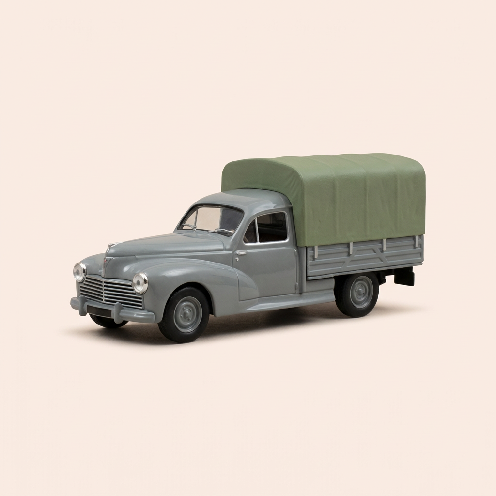 Peugeot 203 pick-up gris avec bâche verte de 1950