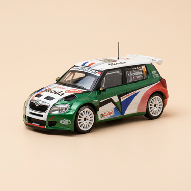 Voiture miniature - Skoda Fabia WRC blanche, verte, rouge et bleue numéro 7 - Rallye Monté-Carlo 2010