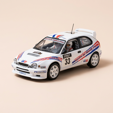 Voiture miniature - Toyota Corolla WRC blanche numéro 33 - Tour de Corse 2000