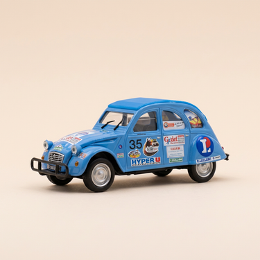 Voiture miniature - Citroën 2 CV 6 bleue claire avec publicités - Norev (sous blister)