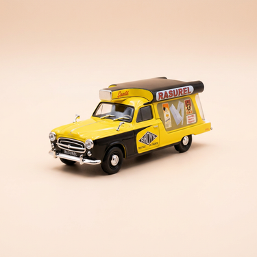 Voiture miniature - Peugeot 403 U8 jaune et noire avec publicité RASUREL (vêtements)
