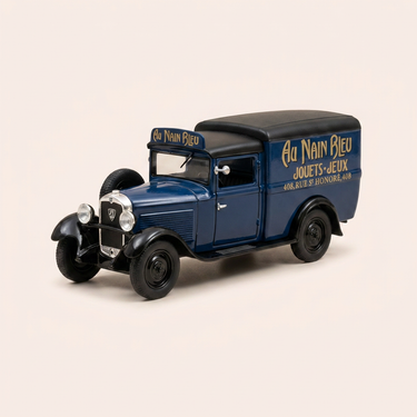 Voiture miniature - Peugeot 301 fourgonnette bleue et toit noir - Publicité pour le magasin de jouets "AU NAIN BLEU" à Paris